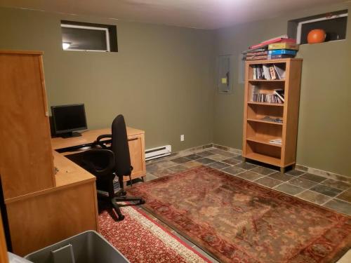 an office with a desk with a chair and a computer at Large Private House on 5 Wooded Acres. Total Privacy! in Hackettstown