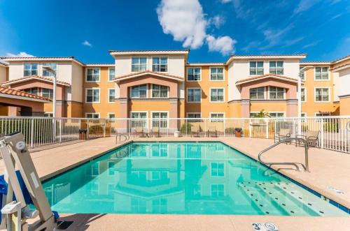 a swimming pool in front of a apartment building at Scottsdale 2 bd 2 ba furnished apt 4 full beds in Scottsdale
