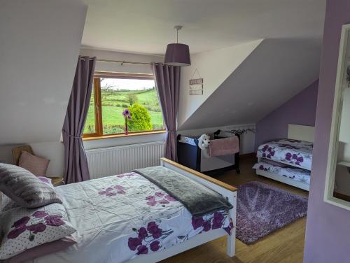 A bed or beds in a room at Glynvohr House