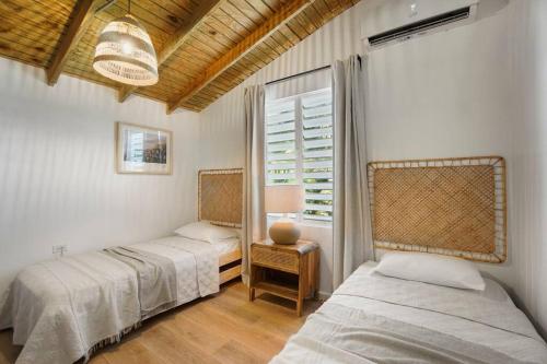 En eller flere senge i et værelse på Villa Costera Joyuda