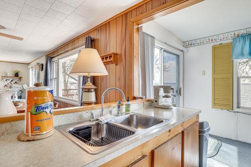 a kitchen with a sink and a counter top at Waterfront Family Cottage on Lake Champlain in Swanton