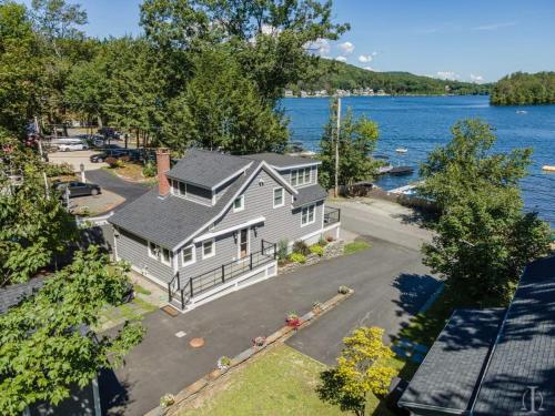 an aerial view of a house on the water at Beautiful Home 30 Feet from the Sand at Spofford Lake! in Chesterfield