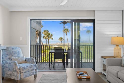 a living room with a view of the ocean at Beach Villa 2614- Captiva Two Bedroom Premier Beachfront Residence in Captiva