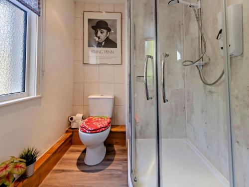 a bathroom with a toilet and a glass shower at 2 Bed in Totnes 94724 in Totnes