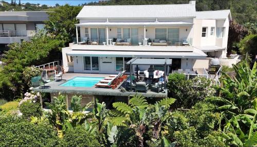 an aerial view of a house with a swimming pool at Lasalle holiday home (Sun, Beach, Views, Fun for everyone!) in Plettenberg Bay