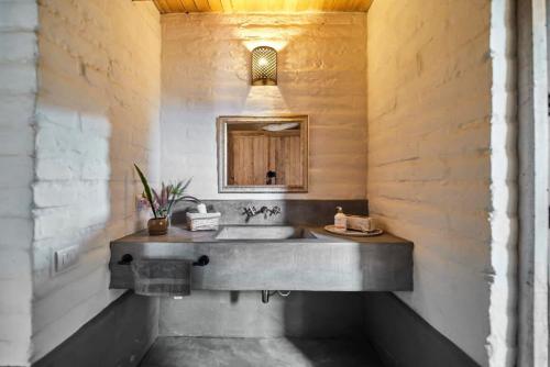 a bathroom with a sink and a mirror at Casa Estrella Malinalco in Malinalco