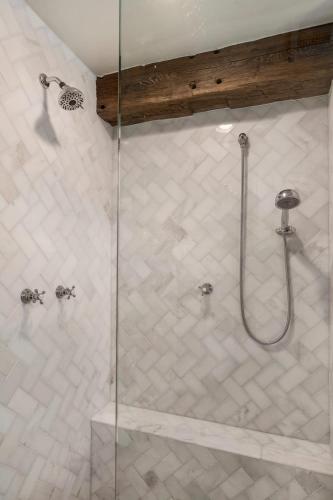 a shower with a glass door in a bathroom at River Hill Ranch, great views & river access! in Flugrath