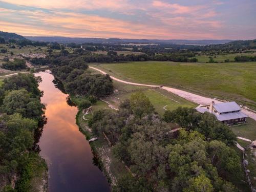 an aerial view of a river with a house at River Hill Ranch, great views & river access! in Flugrath