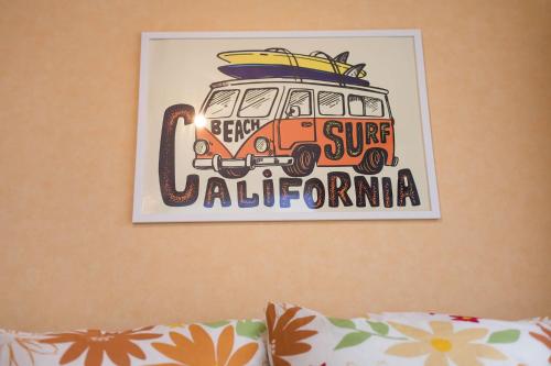 a picture of a van with a surfboard on it at ガジュマルの庭～itoman in Ō