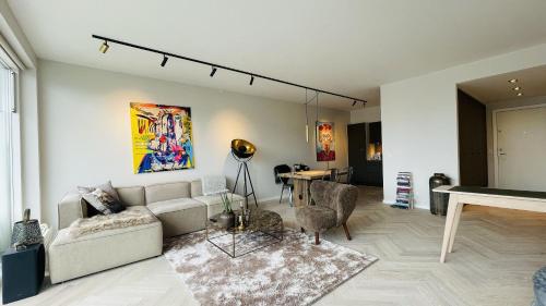 a living room with a couch and a table at ApartmentInCopenhagen Apartment 1613 in Copenhagen