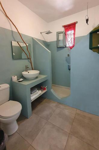 a bathroom with a sink and a toilet at Pefkos Eye in Pefki Rhodes