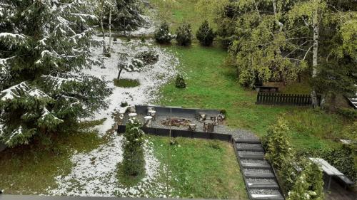 an aerial view of a park with a pond at Zaciszny Zakątek Zawoja in Zawoja