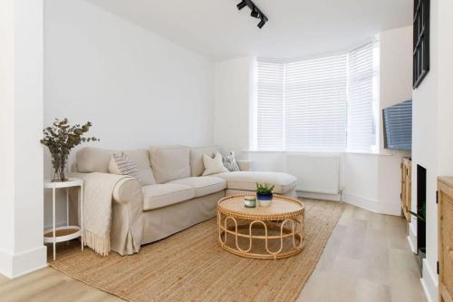 a living room with a couch and a coffee table at Stylish 2 Bed City Stay in Chichester