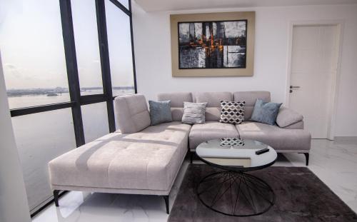 a living room with a couch and a table at Suite 1202 Bellini, Puerto Santa Ana, Guayaquil in Guayaquil