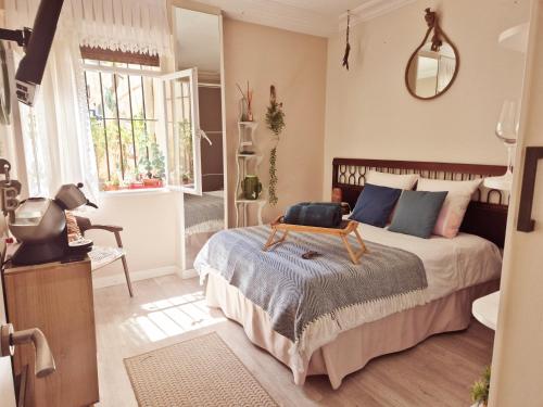 a bedroom with a bed with a table on it at Begutxi LVI00061 in Vitoria-Gasteiz