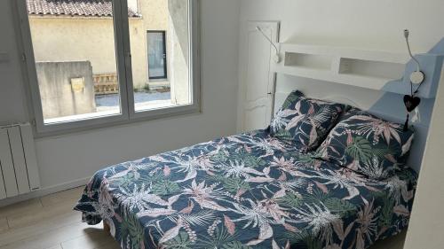 Katil atau katil-katil dalam bilik di Maison de ville au bord de la Charente
