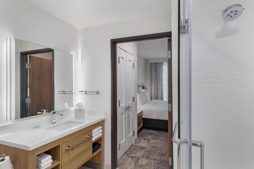 a bathroom with a sink and a mirror at Residence Inn by Marriott Chatsworth in Chatsworth