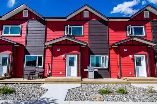a red house with a black roof at NN - Eddy #1 - Whistlebend 3-bed 2 5-bath in Whitehorse