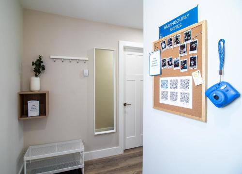 a room with a calendar on the wall and a door at NN - Flats on 4th #3 - Downtown 1-bed 1-bath in Whitehorse
