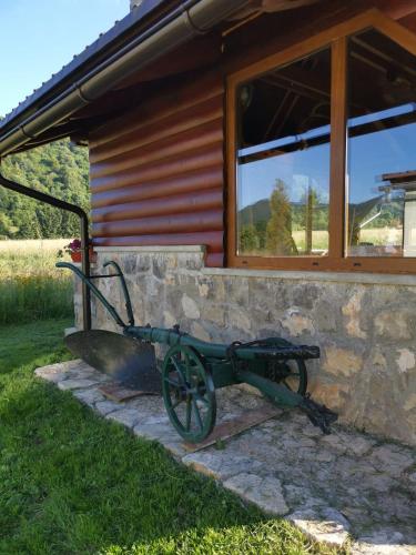 a statue of a wagon outside of a building at Apartment Doris Mrkopalj in Mrkopalj