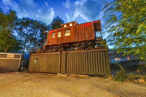 a train car sitting on top of a building at 1920s Red Rock Caboose Bike Hike Explore in Colorado Springs