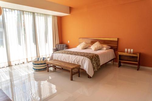 Säng eller sängar i ett rum på Hotel Wellness - Belleza y Serenidad