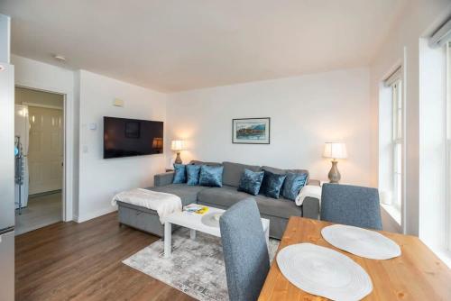 a living room with a couch and a table at NN - The Summit - Copper Ridge 1-bed 1-bath in Whitehorse