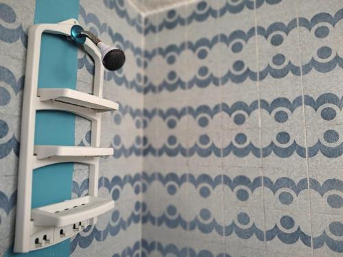 a microphone in a bathroom with a wall at ON THE BEACH SURFERS SUNRISE HAVEN 3 in Cancún