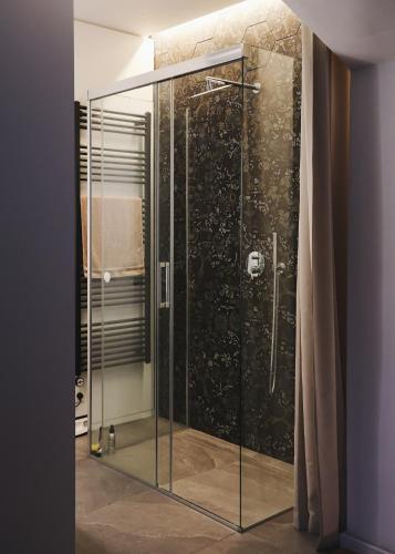 a shower with a glass door in a bathroom at Villa Rodica, Bled in Bled