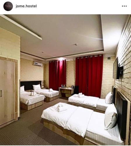 Ένα ή περισσότερα κρεβάτια σε δωμάτιο στο Jome Hostel