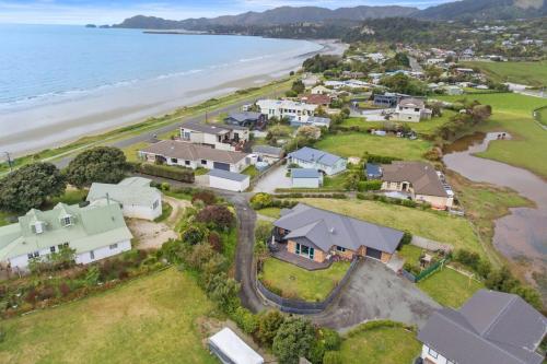 an aerial view of a home next to the beach at Pohara Beach Life in Pohara