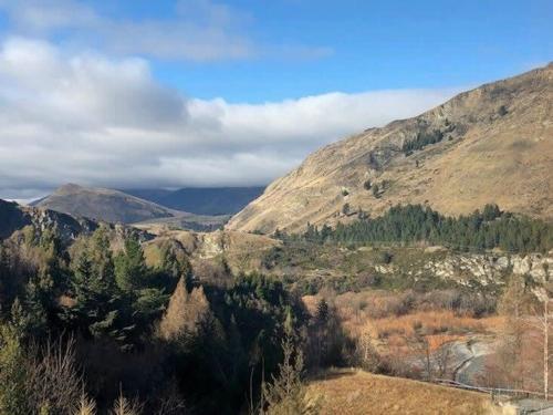 a view of a valley with trees and mountains at Shotover Serenity in Queenstown