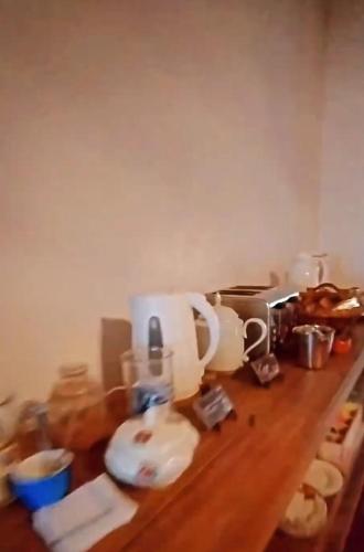 a kitchen counter with a coffee maker on it at Tanino Home Suites in Mendoza