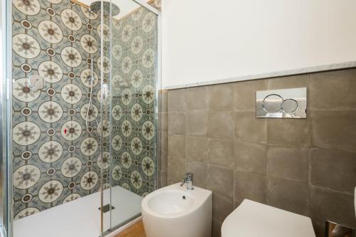 a bathroom with a shower and a toilet and a sink at Le camere sui colli in La Spezia
