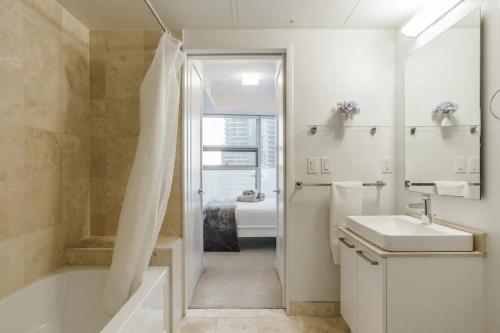 a bathroom with a tub and a sink and a shower at The One - Make Memories! - Urban City - Boutique in Toronto