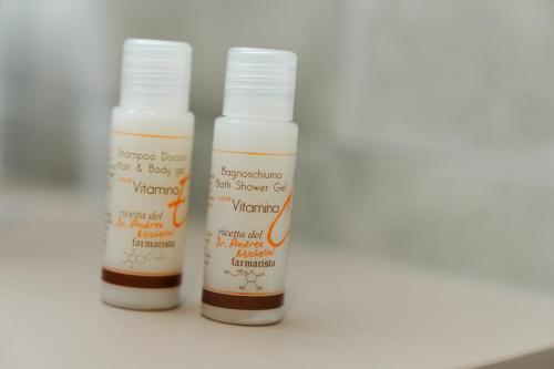 three bottles of moisturizers sitting next to each other at Le camere sui colli in La Spezia