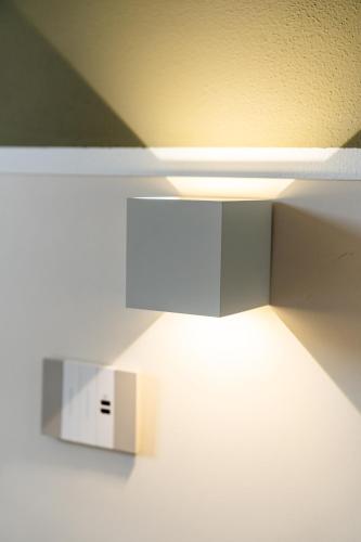 a light hanging from a ceiling in a room at Le camere sui colli in La Spezia