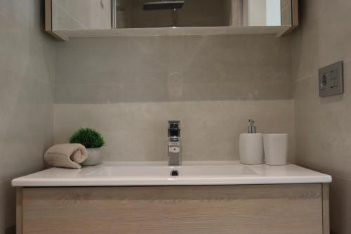 a bathroom with a sink and a mirror at Azure Sky Villa - Panoramic ocean view, luxury, San Eugenio in Adeje