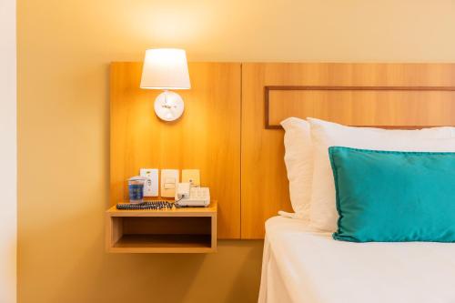 Katil atau katil-katil dalam bilik di Hotel Golden Park Uberlandia By Nacional Inn