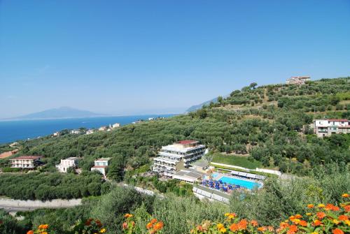 a resort on a hill with a swimming pool at Best Western Hotel La Solara in Sorrento