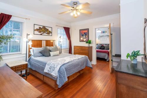 a bedroom with a bed and a ceiling fan at The Nelson House Unbeatable Location in New Orleans
