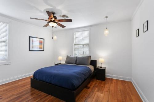 a bedroom with a bed and a ceiling fan at 4BD Metairie retreat with driveway and yard in Metairie