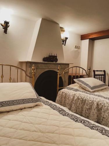 מיטה או מיטות בחדר ב-Cantinho de Aldeias