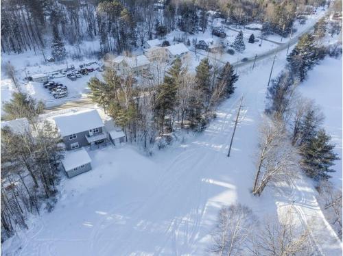 an aerial view of a house in the snow at The Artistry I Sled In & Sled Out I Riverside I TV in Bancroft