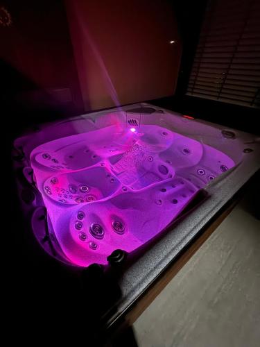a purple table with a pink light on it at Vila 1921 in Jevišovice