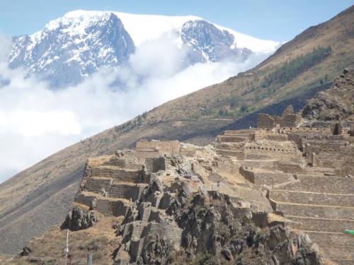 an ancient incan city on the side of a mountain at Hotel Tierra Inka Sacred Valley in Ollantaytambo