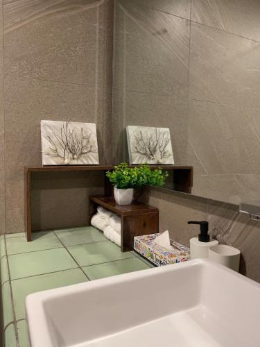 a bathroom with a tub and a mirror and a sink at Beautiful Ocean View Penthouse With Private Pool -C301 in Holbox Island