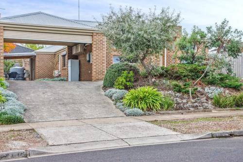 a driveway leading to a house with bushes and trees at Reconnect on Daly I Epworth and Deakin in Geelong