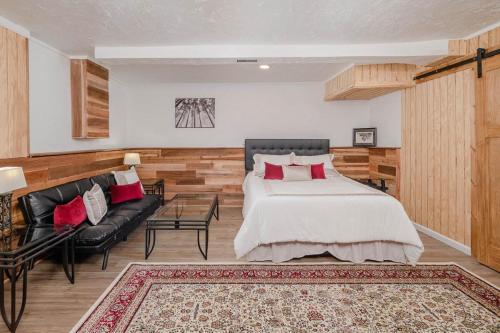 a bedroom with a large bed and a couch at Pine in Appleton