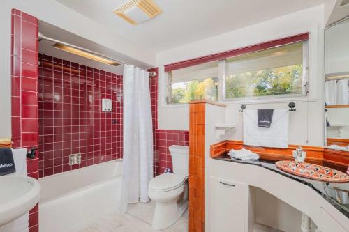 a bathroom with a toilet and a sink at Stay at Sunset Shoreline Lakehouse in Oshkosh